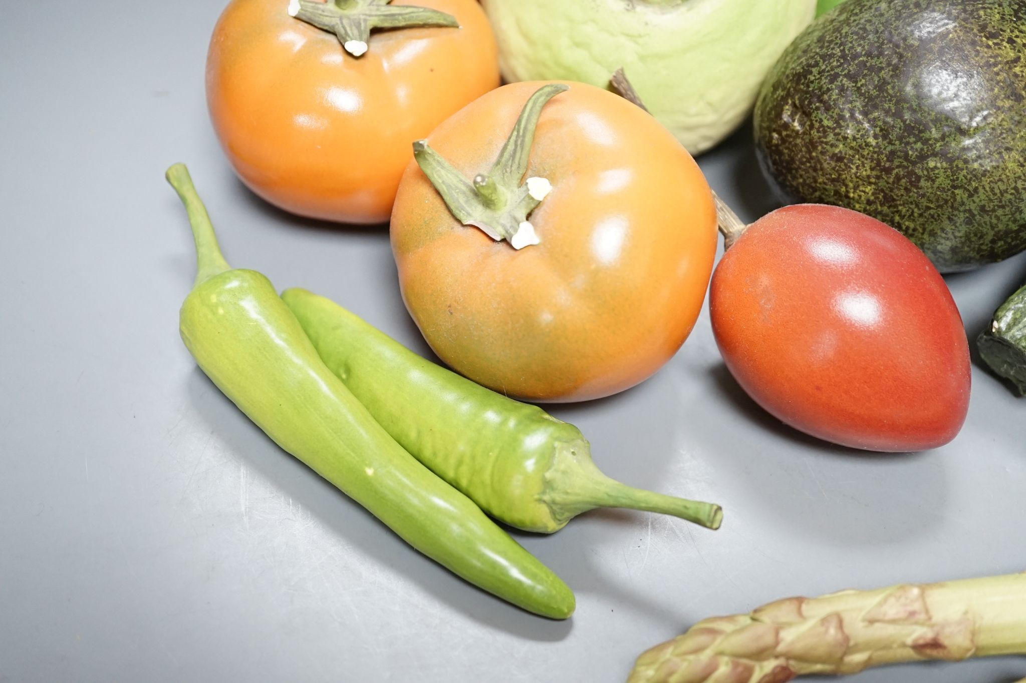 A collection of vintage Penkridge ceramic vegetables including an artichoke, avocado, peppers and asparagus (19 items)